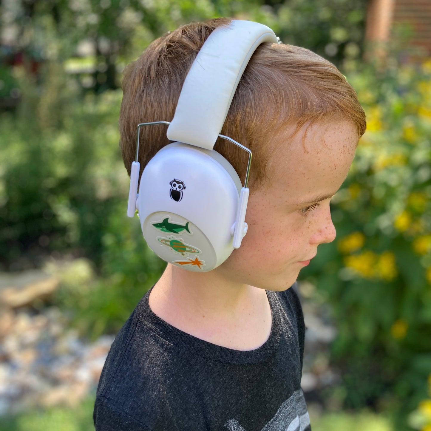 boy wearing hearing protection with stickers