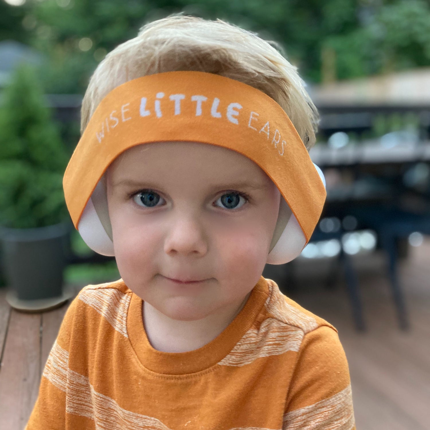 toddler wearing hearing protection with orange band